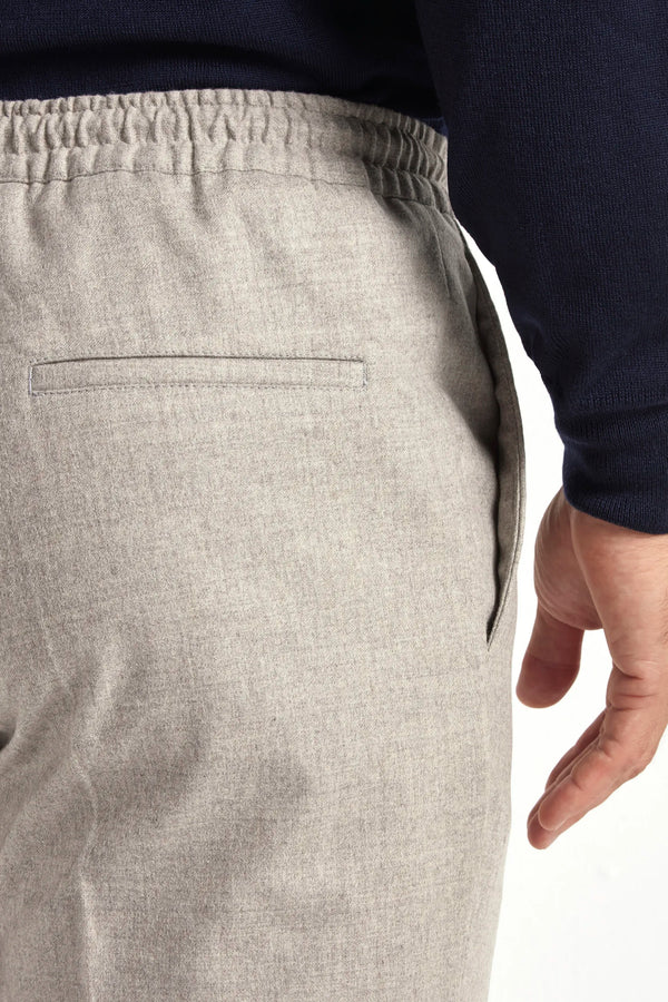 beige flannel drawstring trousers, italian style, made in italy, wool flannel trousers, luxury casual trousers, elegant drawstring pants, tailored flannel trousers, premium italian trousers, versatile wool trousers, refined menswear trousers, winter drawstring trousers, soft flannel trousers, relaxed fit wool trousers, upscale casual trousers, italian craftsmanship trousers, polished drawstring trousers, classic beige flannel trousers, sophisticated winter trousers, comfortable wool trousers, timeless itali